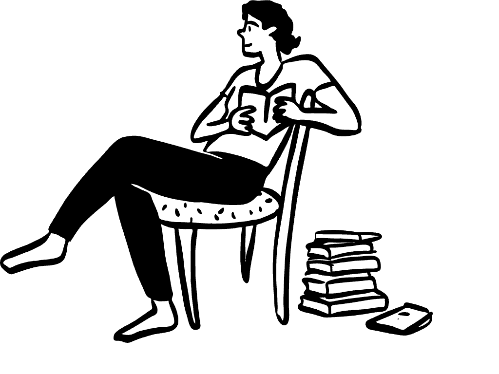 A woman sits on a chair and reads books